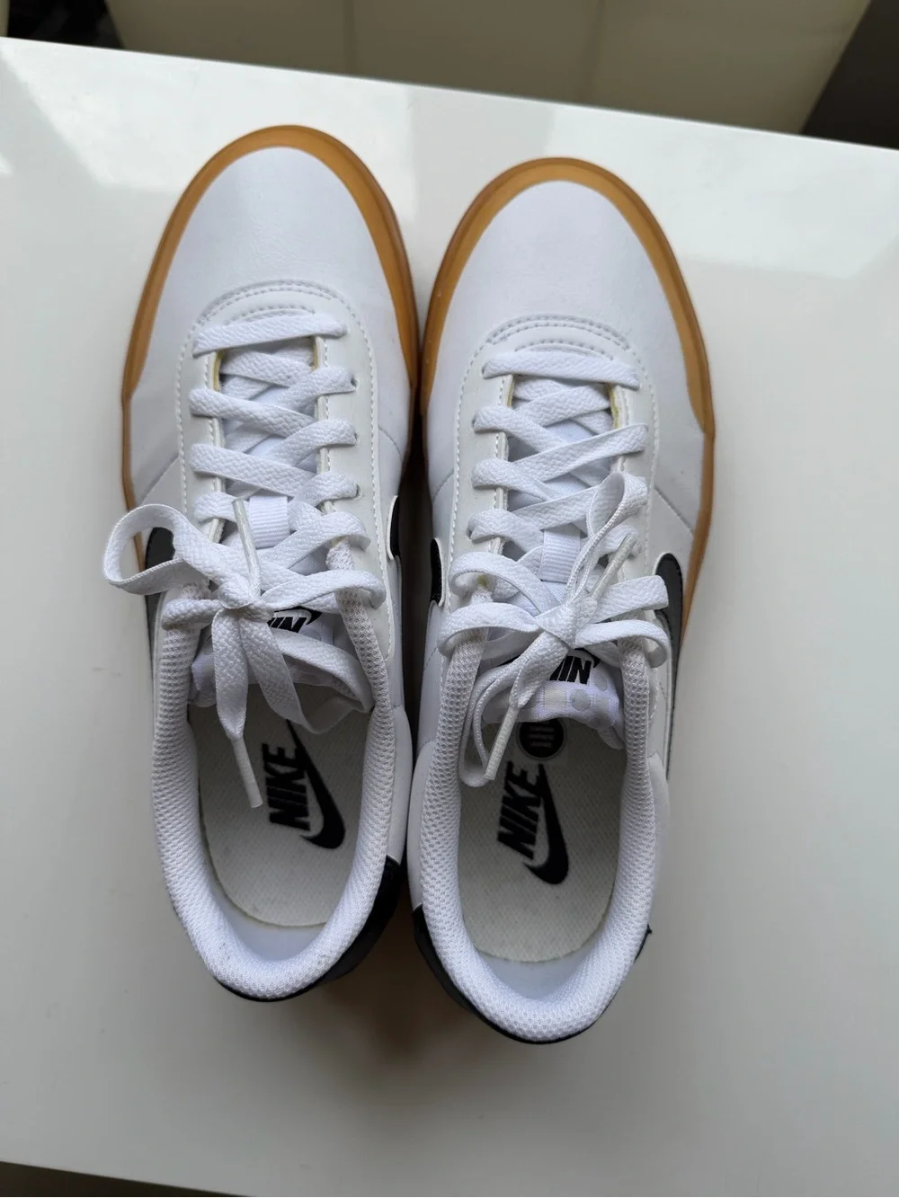 Nike White Leather Sneakers with Black Swoosh and Gum Sole